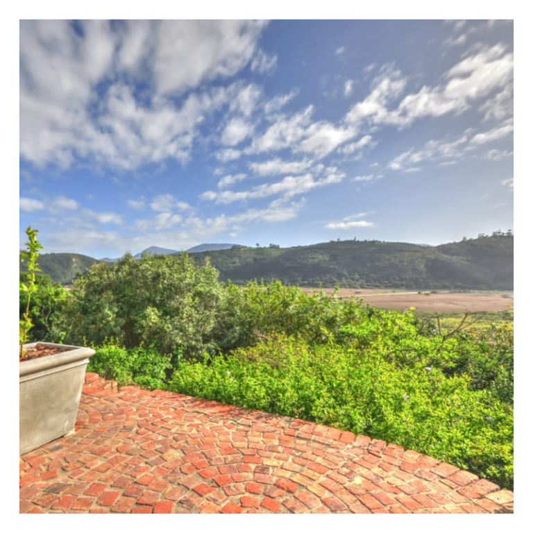 Red door cottage view over Serpentime Wilderness